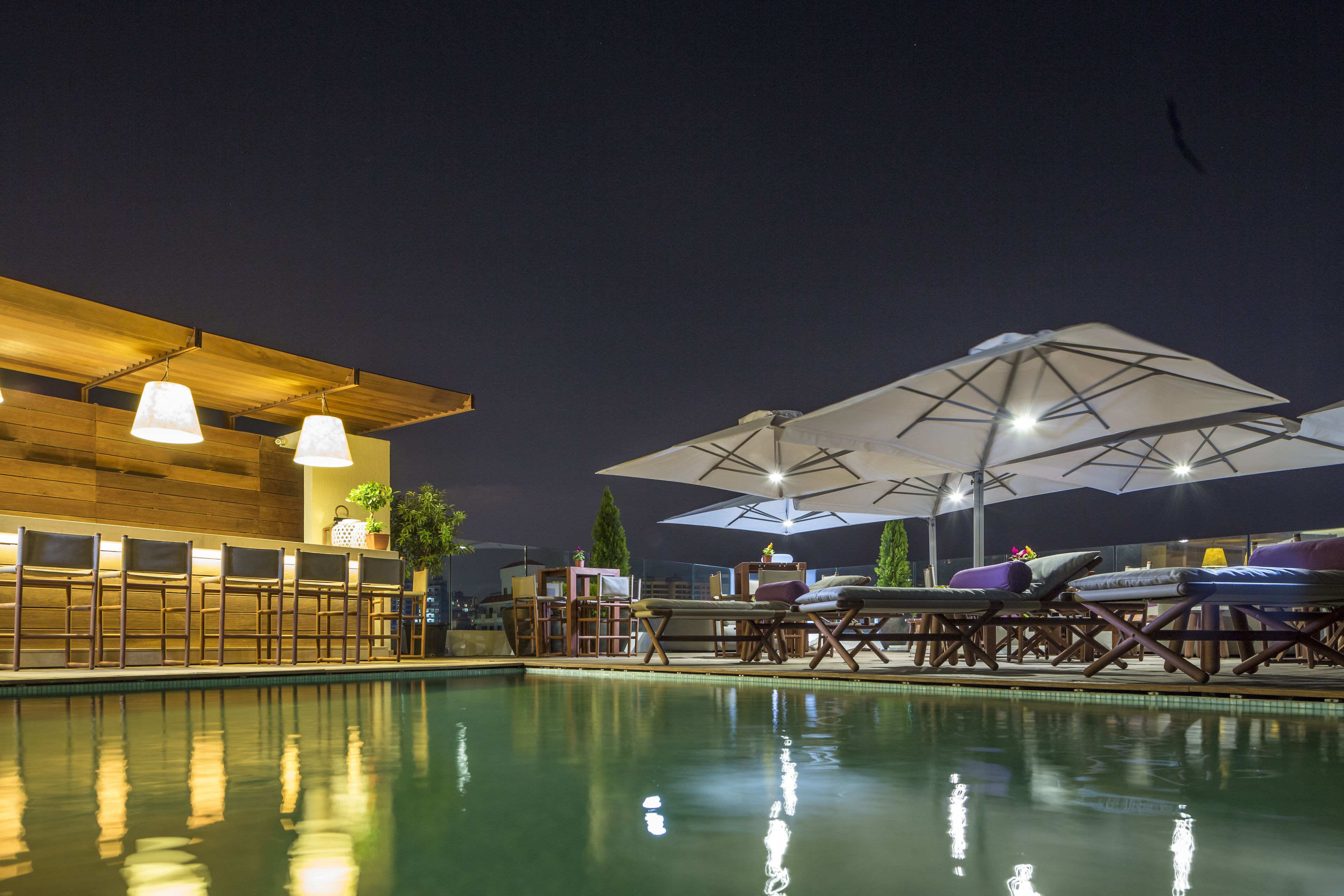 outdoor pool, open 7:00 am to 5:00 pm, pool umbrellas, pool loungers
