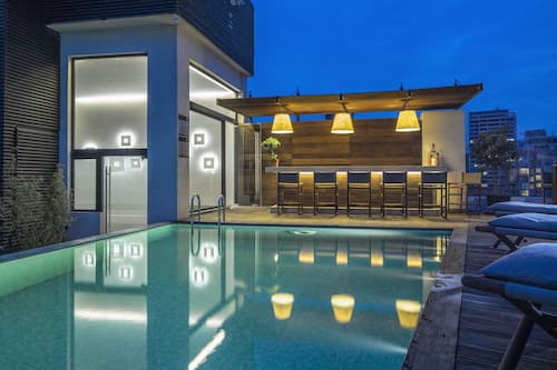 Outdoor pool, open 7:00 AM to 5:00 PM, pool umbrellas, sun loungers