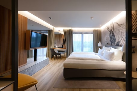 Comfort stĂșdiĂł lakosztĂĄly, 1 hĂĄlĂłszobĂĄval, nemdohĂĄnyzĂł, kilĂĄtĂĄssal a kertre | PrĂ©mium ĂĄgynemƱ, ĂrĂłasztal Ă©s laptophoz jĂłl hasznĂĄlhatĂł munkafelĂŒlet