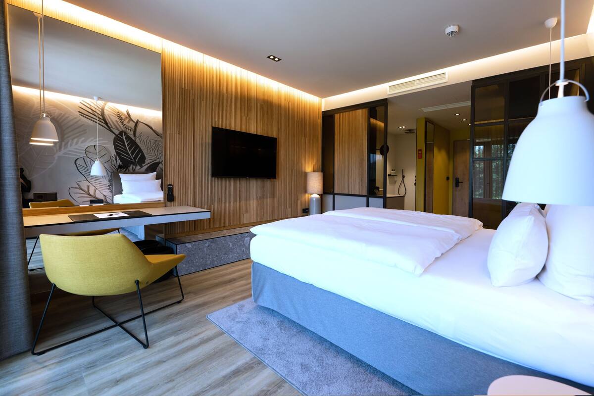 comfort double room | premium bedding, desk, laptop workspace, soundproofing