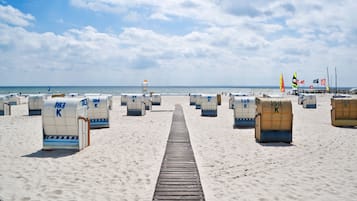 On the beach, white sand, sun loungers