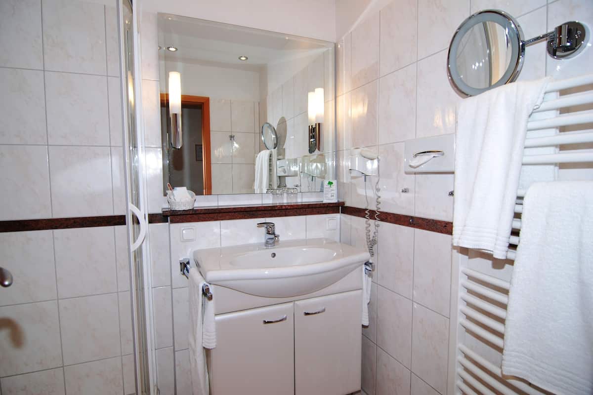 double room, lake view | bathroom amenities | shower, hair dryer, bathrobes, slippers