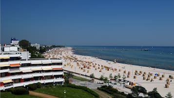On the beach, white sand, sun loungers