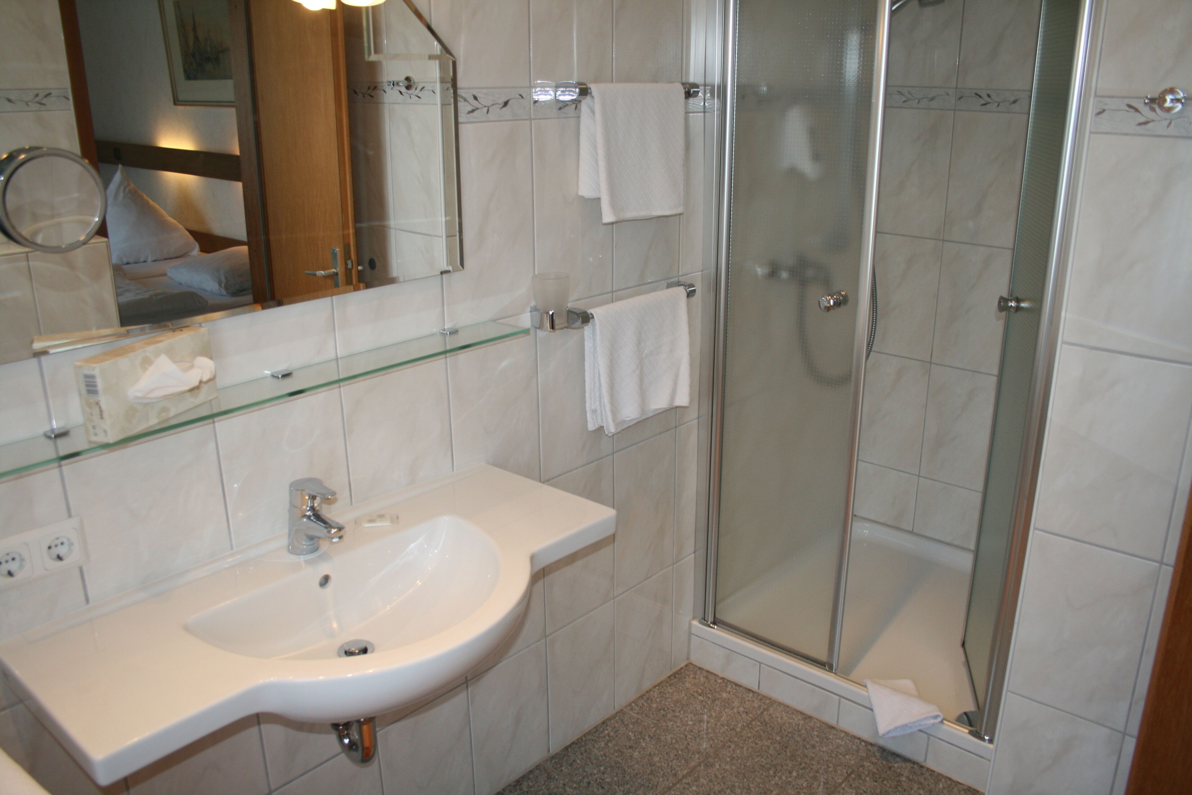 standard double room | bathroom | shower, hair dryer, soap, shampoo