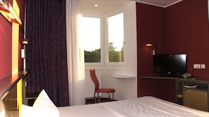 Habitación individual | Minibar, escritorio, espacio para trabajar con laptop y cunas gratuitas