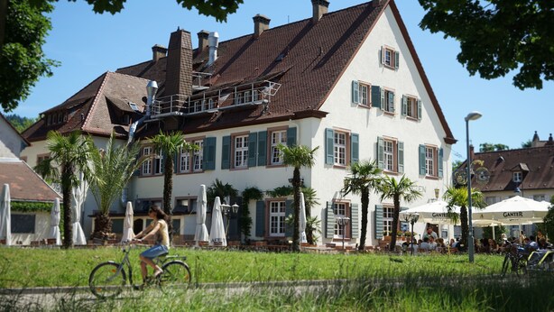 A large, two-story building with a steeply pitched roof and multiple chimneys. - Hotel Gasthaus Schützen (Freiburg im Breisgau)