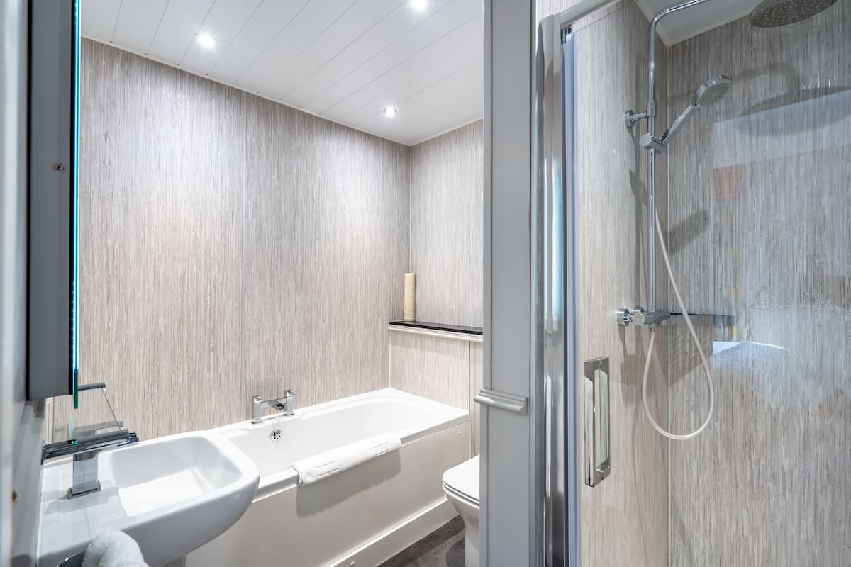 double guest room plus | bathroom | free toiletries, hair dryer, slippers, towels