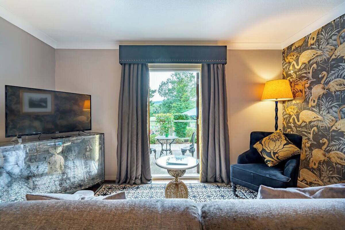 deluxe king room with balcony | premium bedding, individually decorated, individually furnished, desk