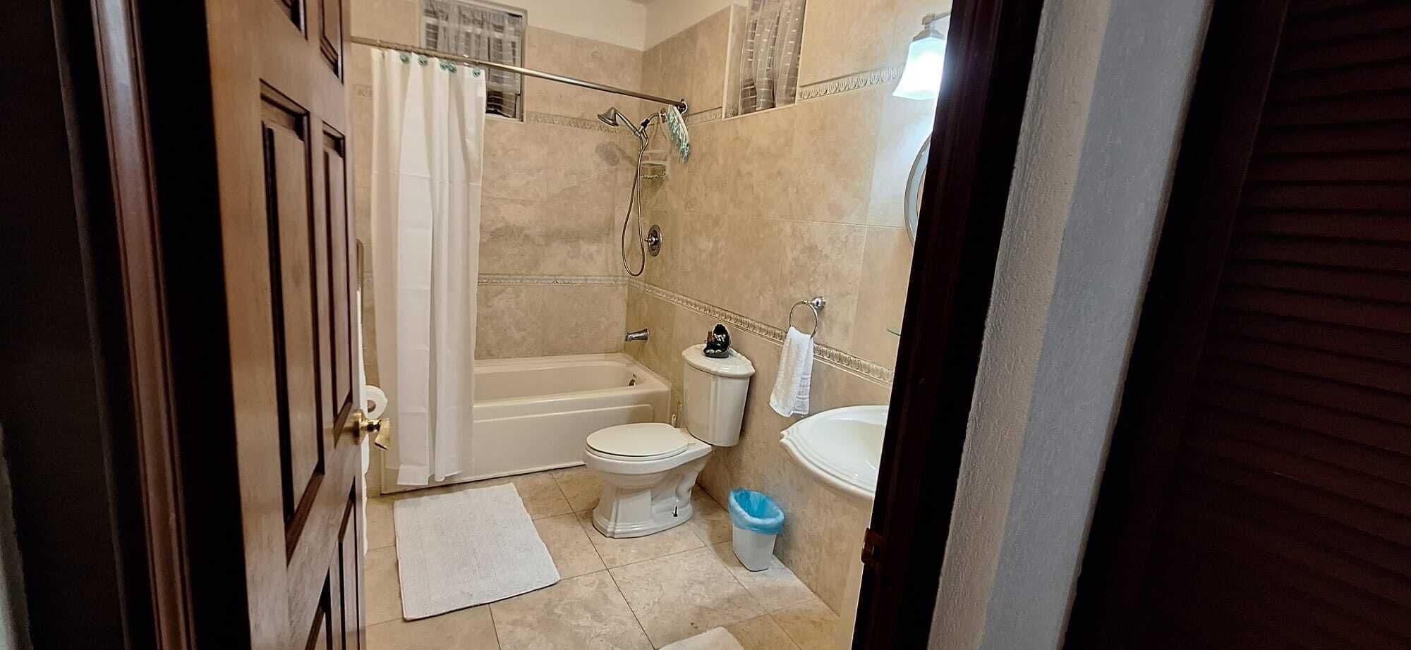 two bedroom garden view villa | bathroom | combined shower/bathtub, deep-soaking bathtub, hydromassage showerhead