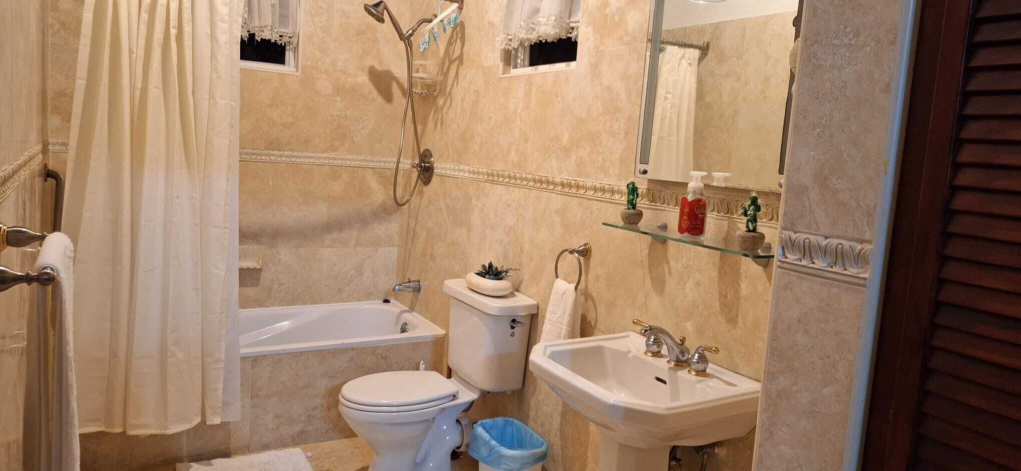 three bedroom ocean view villa | bathroom | combined shower/bathtub, deep-soaking bathtub, hydromassage showerhead