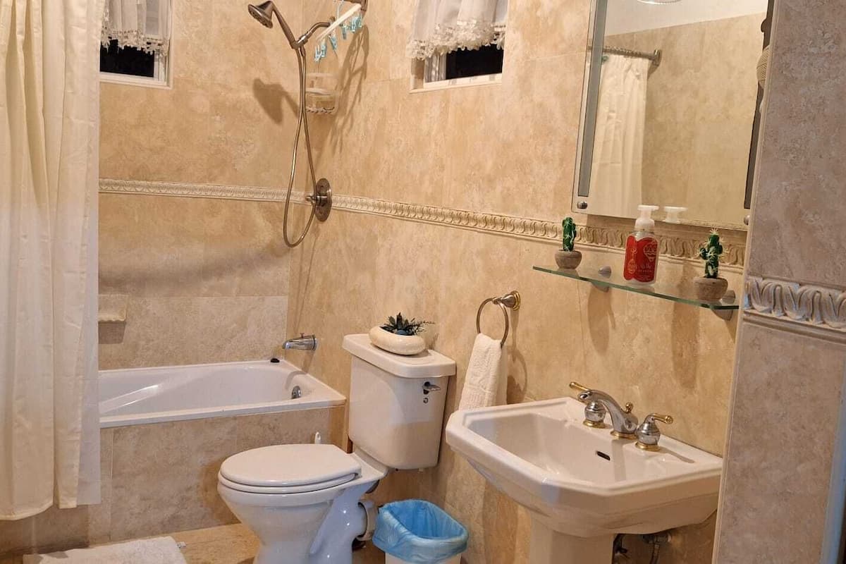 three bedroom ocean view villa | bathroom | combined shower/bathtub, deep-soaking bathtub, hydromassage showerhead