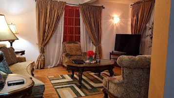 Two Bedroom Garden View Villa | Living area | 50-inch LED TV with cable channels, Netflix, first-run movies