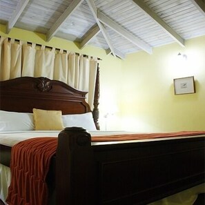A single bed with a wooden headboard, white bedding, and a red blanket. - Altamont Court Hotel (Kingston)