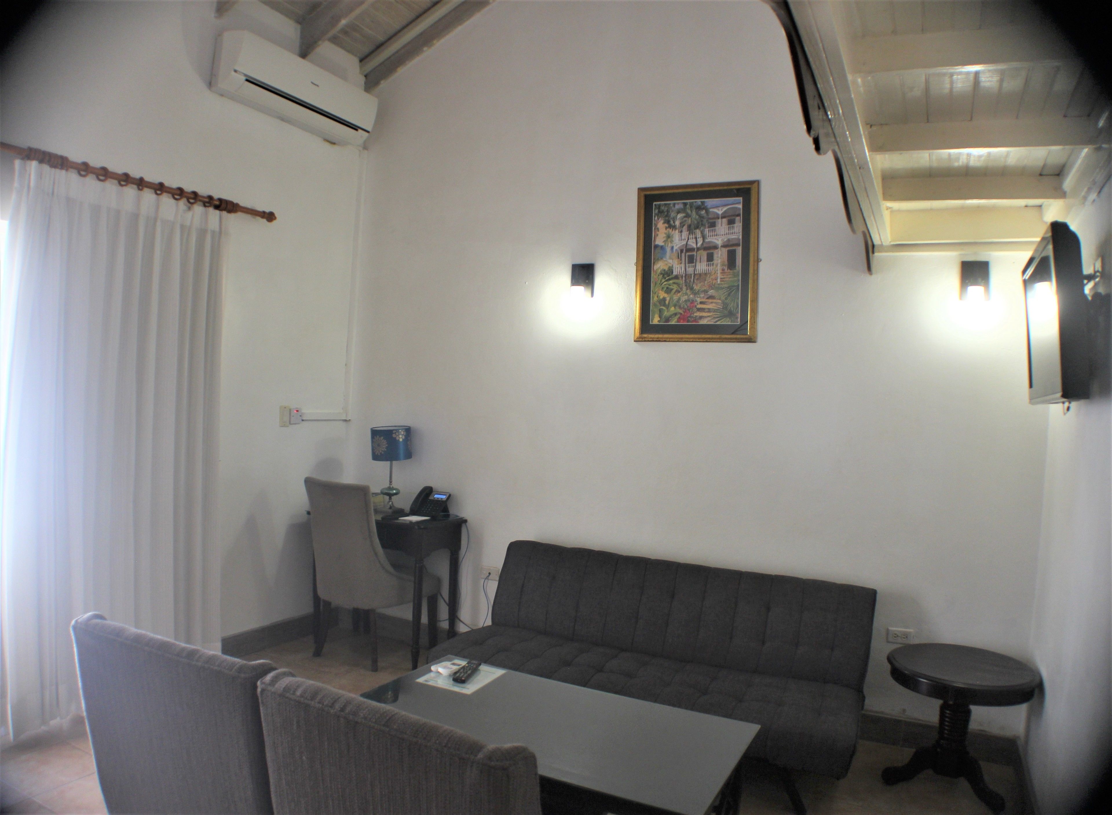 superior suite, non smoking | living area | flat-screen tv