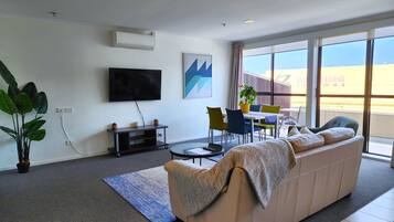 Apartment, 2 Bedrooms, Private Bathroom | Living area | 50-inch LCD TV with premium channels, TV, Netflix