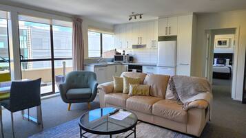 Apartment, 2 Bedrooms, Private Bathroom | Living area | 50-inch LCD TV with premium channels, TV, Netflix