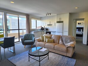 Apartment, 2 Bedrooms, Private Bathroom | Living area | 50-inch LCD TV with premium channels, TV, Netflix