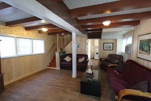 Beach1 Roost, 3 Bedrooms, 4 Double Beds with Sofabed, Kitchen | Living area | Flat-screen TV - Riverview Cottages (Wasaga Beach)