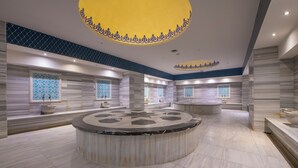 A spacious lobby with a central circular marble feature, patterned windows, and a distinctive yellow and blue ceiling design. - Crowne Plaza Kayseri by IHG (Kayseri)