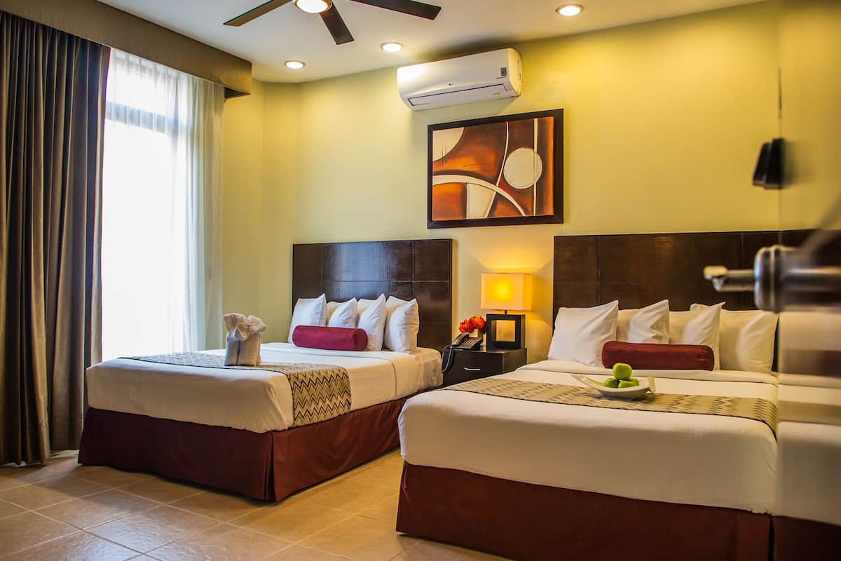 deluxe room | 1 bedroom, in-room safe, desk, iron/ironing board