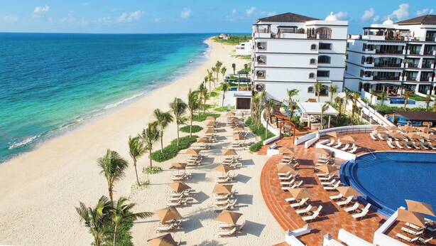 A resort with a beach, a pool, and multiple buildings. - Holiday Inn Club Vacations Grand Residences by IHG - All Inclusive (Puerto Morelos)