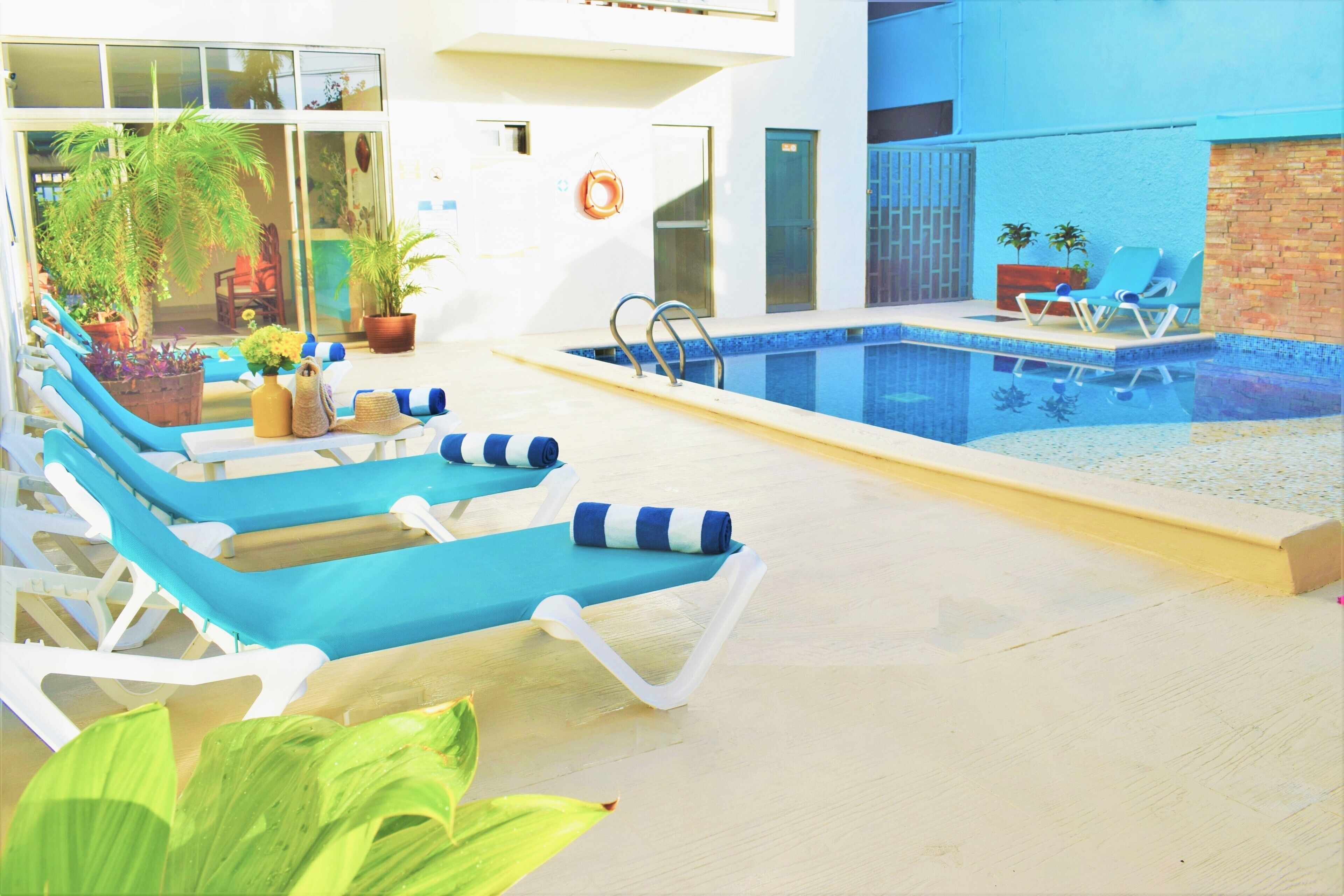 outdoor pool, pool loungers