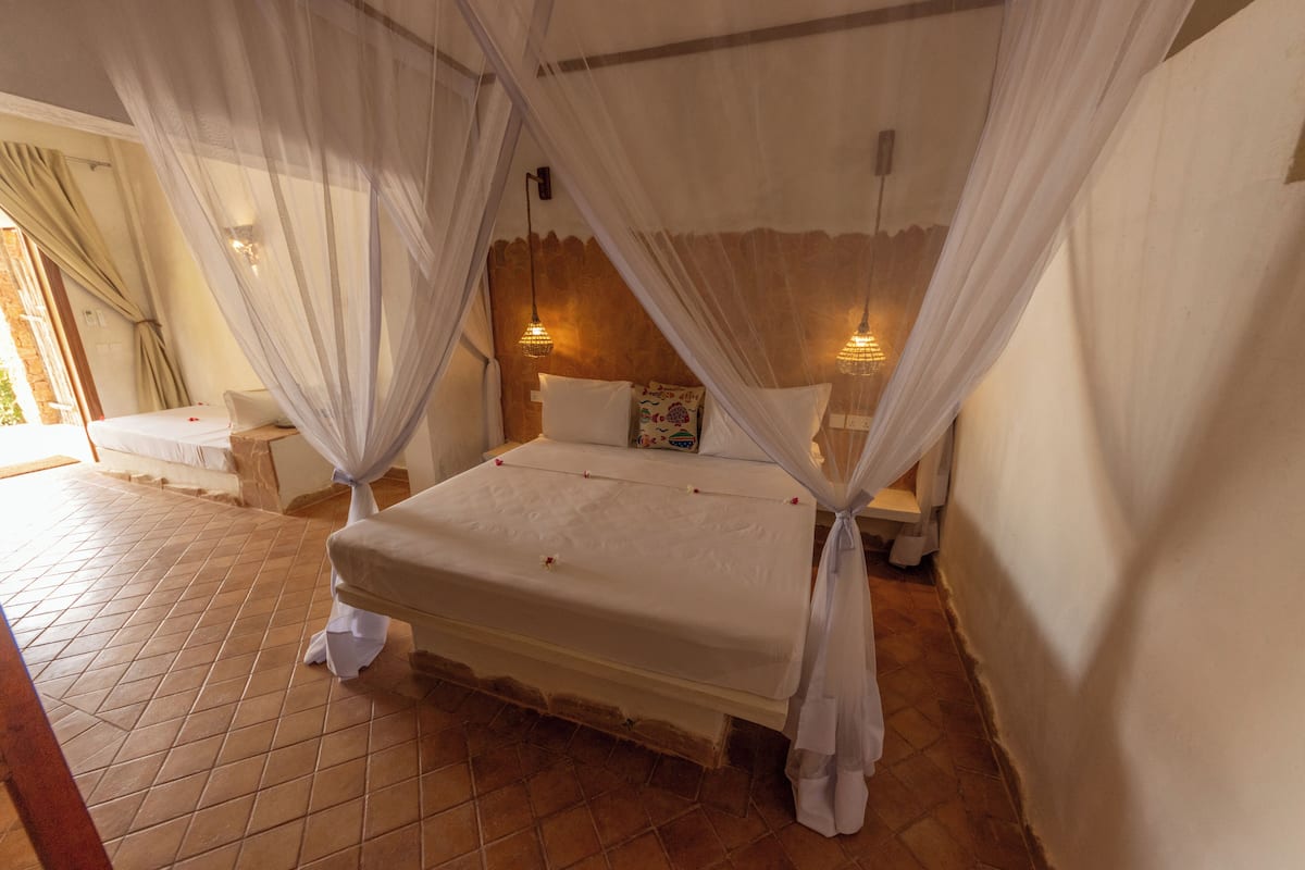 Superior Quadruple Room, Partial Sea View | In-room safe, free WiFi, bed sheets