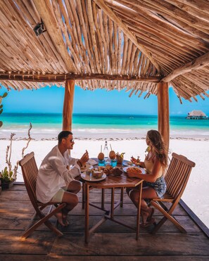 2 restaurants; breakfast, lunch and dinner served  - Mvuvi Boutique Resort (Kiwengwa)