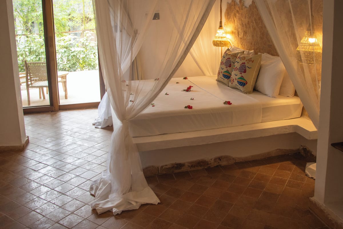 Deluxe Triple Room, Garden View | In-room safe, free WiFi, bed sheets