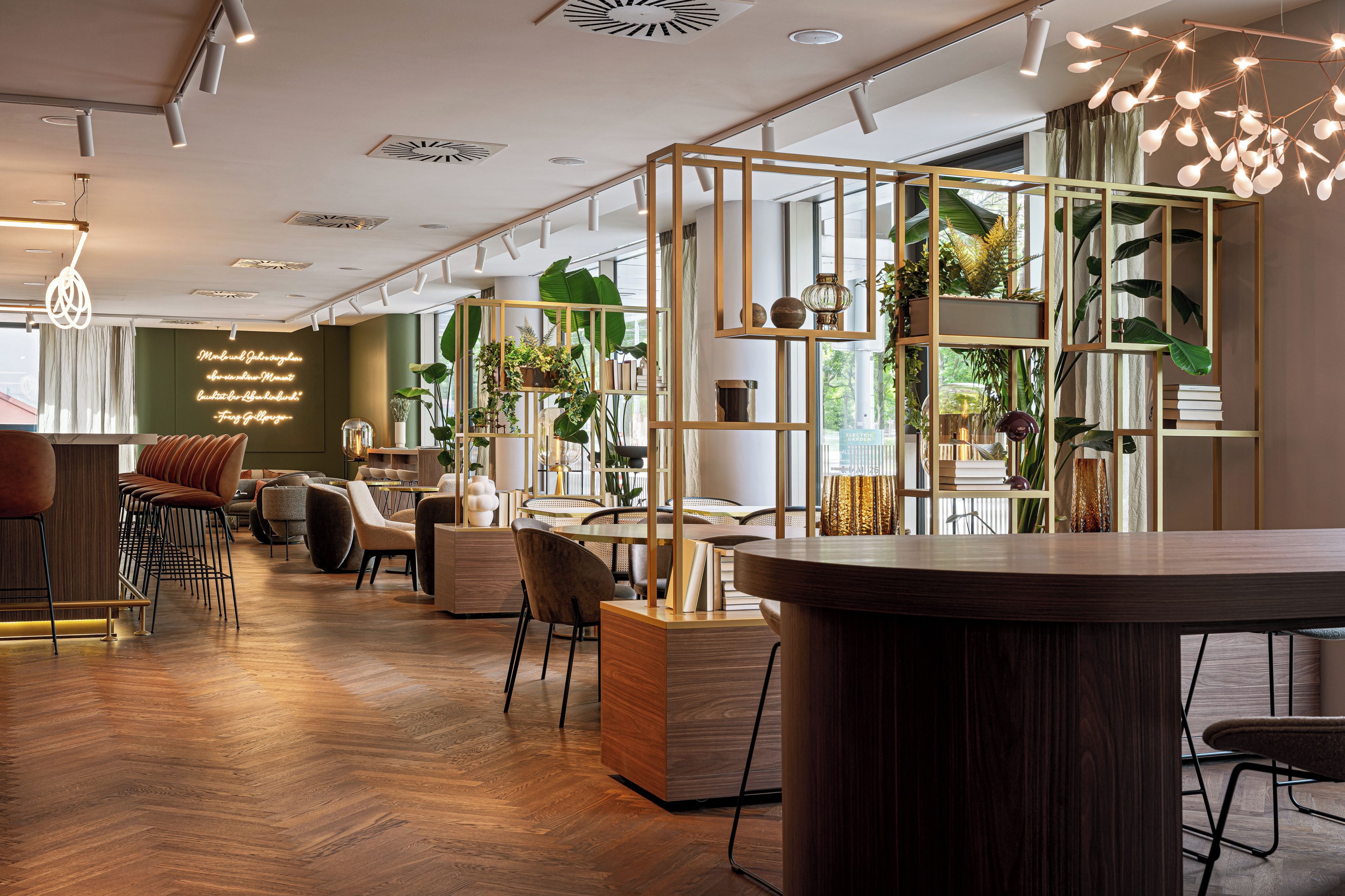 A modern interior with a wooden floor, seating area, and a bar counter.