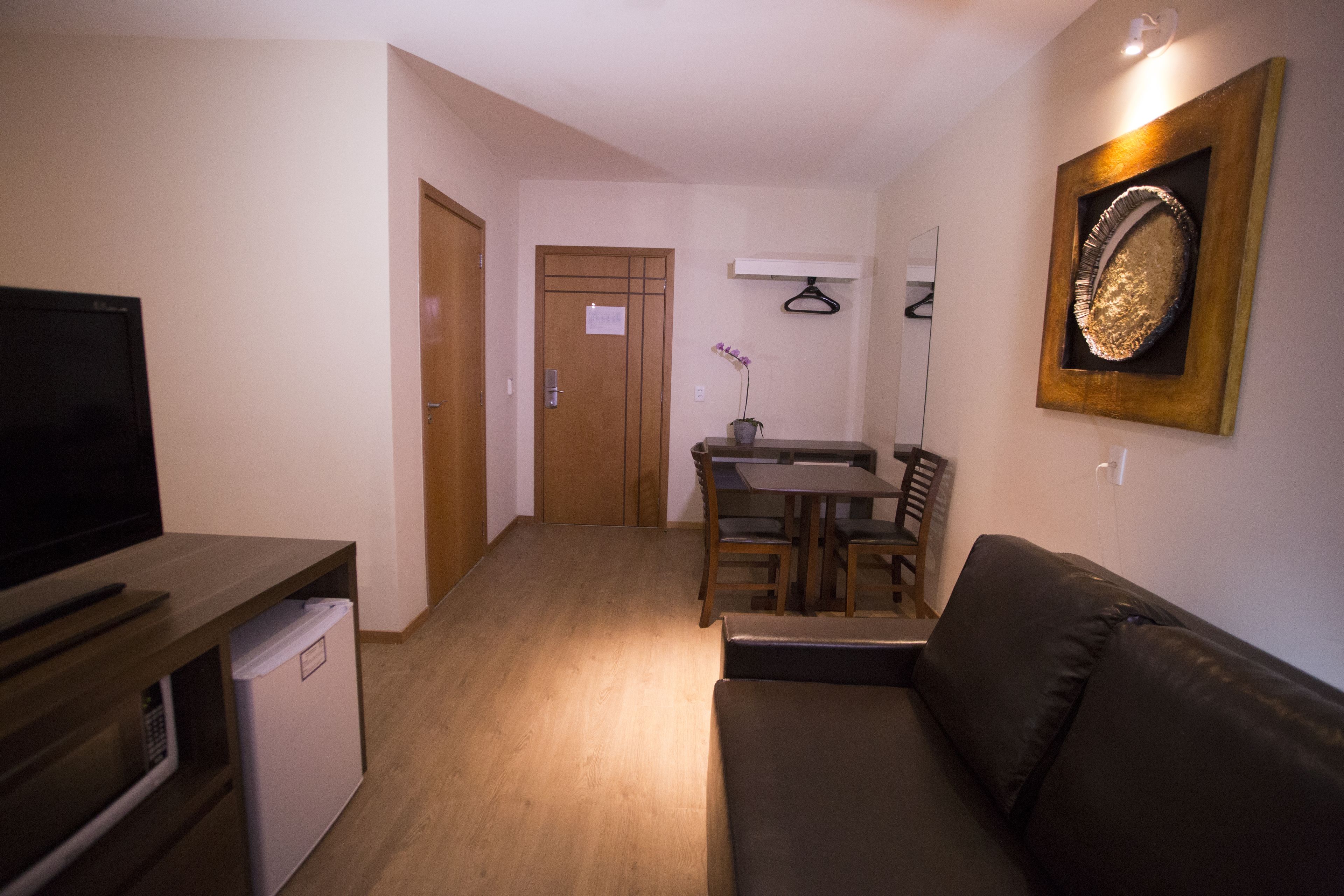 deluxe room | minibar, in-room safe, desk, laptop workspace