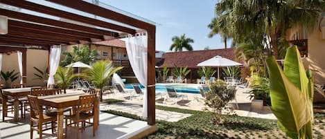 Outdoor pool, pool umbrellas, sun loungers