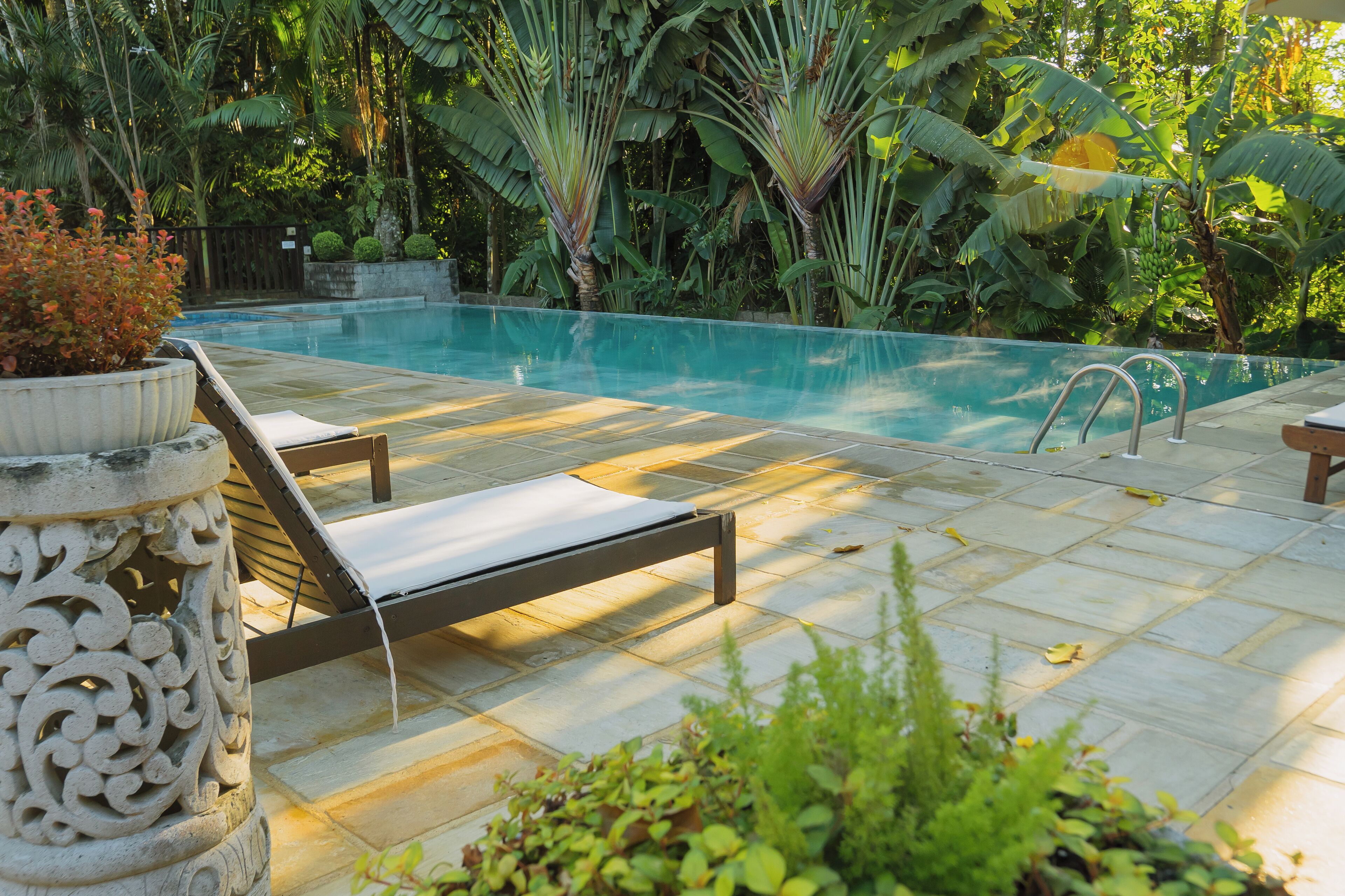 outdoor pool, open 7 am to 10 pm, pool umbrellas, pool loungers