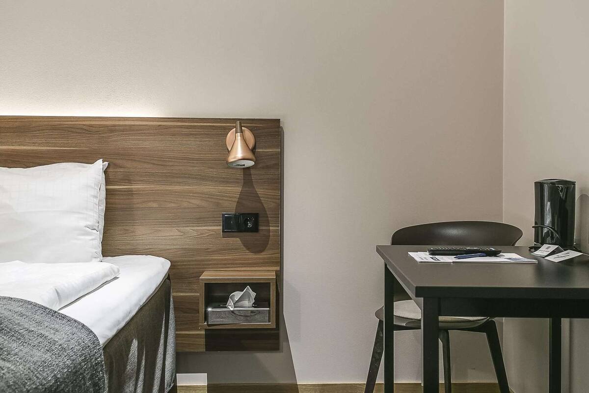 Desk, laptop workspace, blackout drapes, iron/ironing board