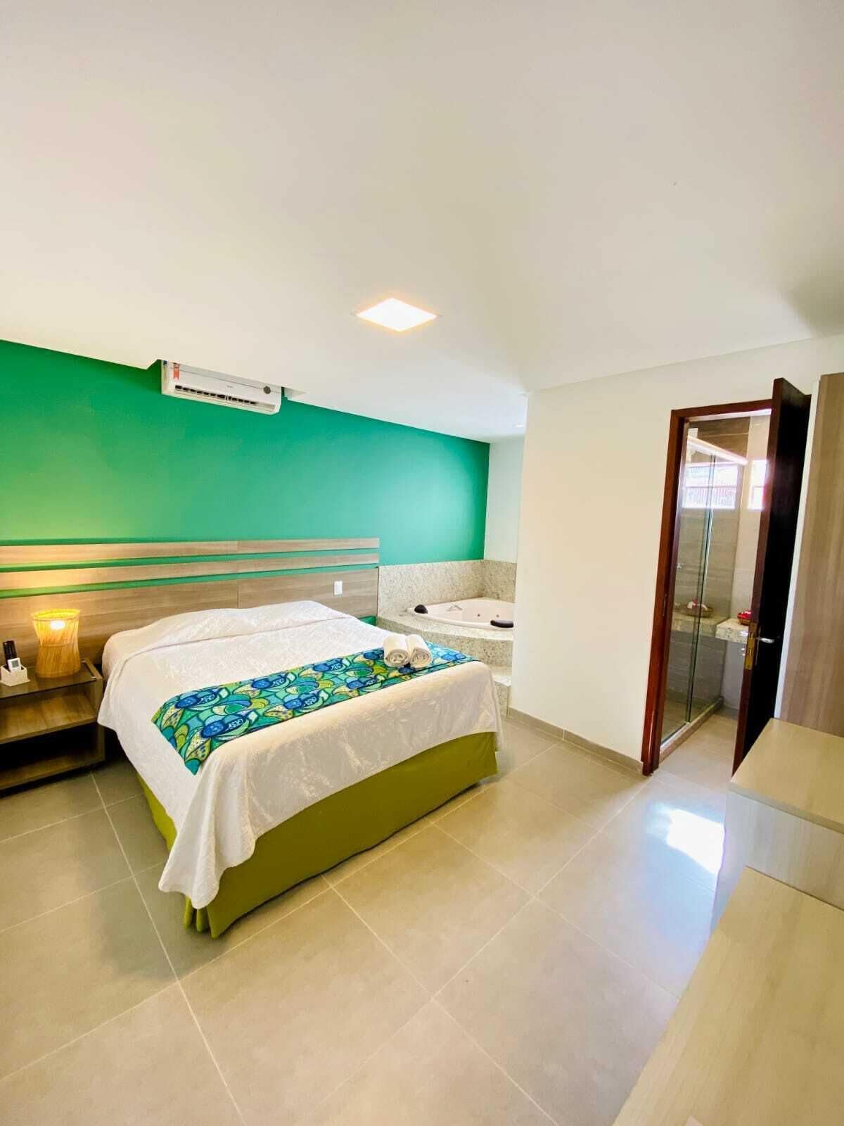 Deluxe Double Room, Hot Tub | Minibar, blackout drapes, iron/ironing board, free WiFi