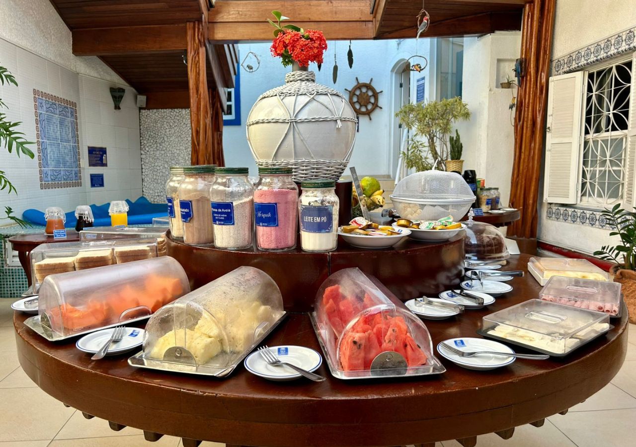 A buffet with various food items and condiments.