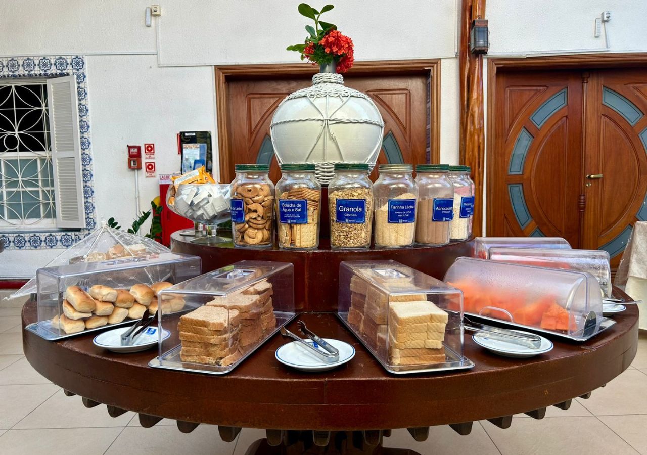 A buffet setup with various food items and condiments.