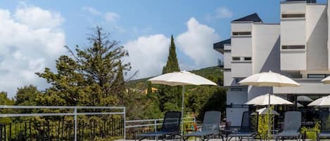 Seasonal outdoor pool, pool umbrellas, pool loungers