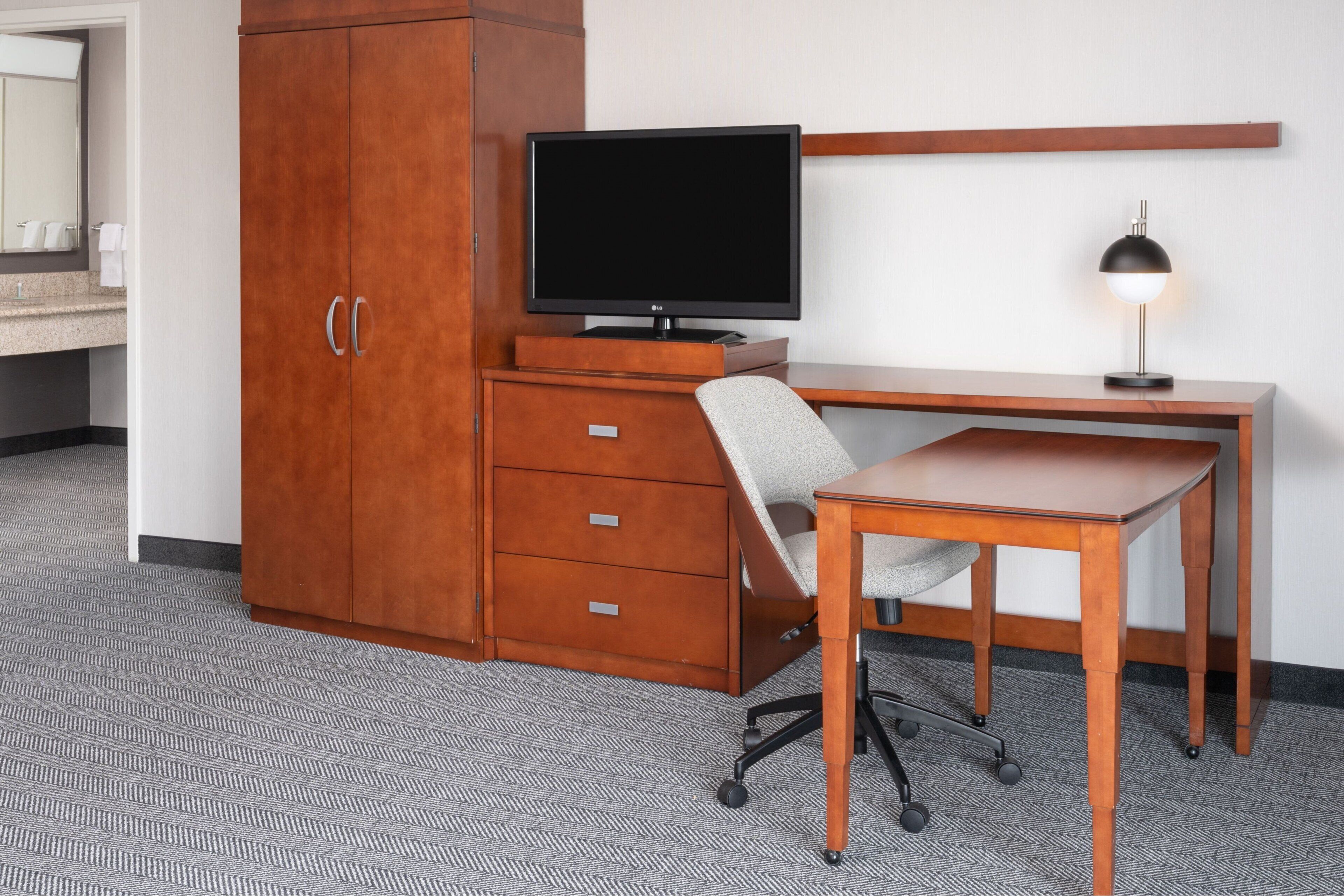 desk, laptop workspace, blackout curtains, iron/ironing board