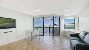 Executive 2 Bedroom Waterfront Rooftop | Living area | Flat-screen TV