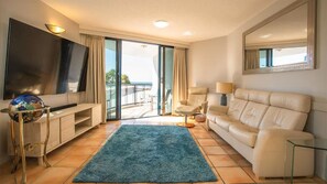 Apartment | Living area | Flat-screen TV - La Promenade Absolute Waterfront Apartments (Caloundra)