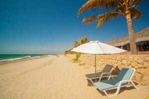 Private beach, white sand, beach towels, beach massages