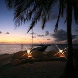 On the beach, white sand, beach umbrellas, beach towels