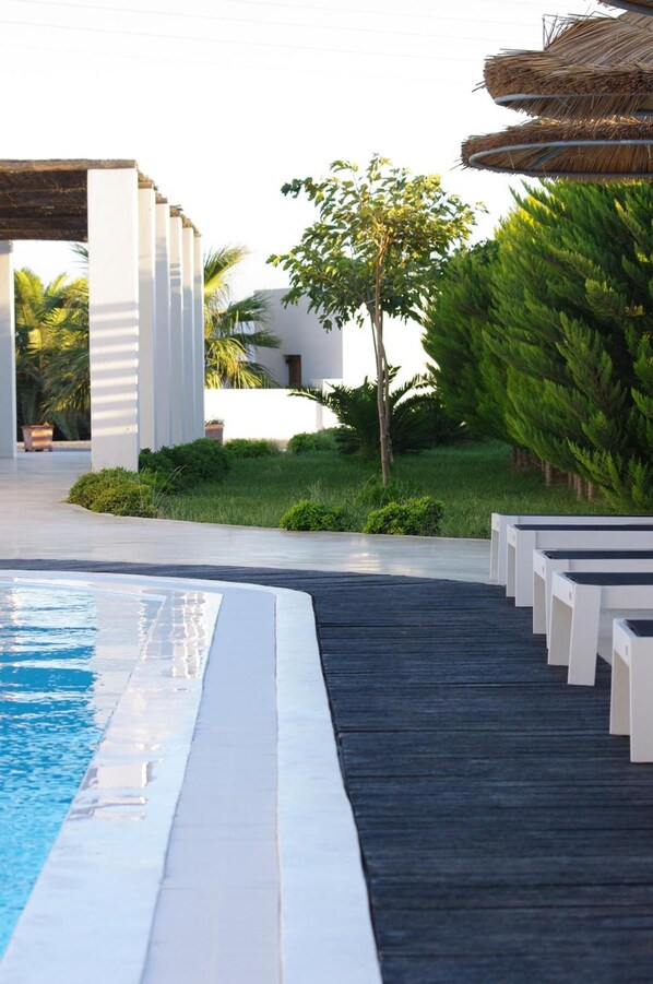 Seasonal outdoor pool, pool umbrellas, pool loungers