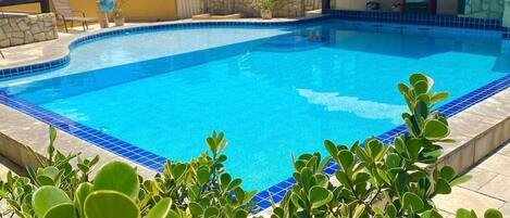 Outdoor pool, pool umbrellas, sun loungers