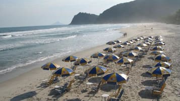 White sand, sun-loungers, beach umbrellas