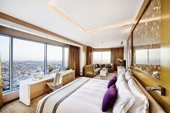 Premium bedding, down comforters, free minibar items, in-room safe