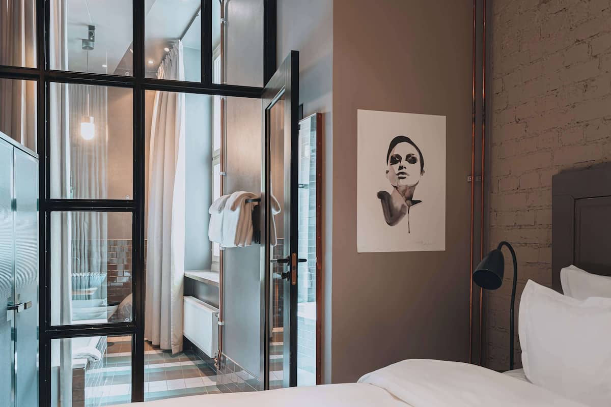 deluxe room, 1 queen bed | premium bedding, in-room safe, individually decorated, blackout curtains