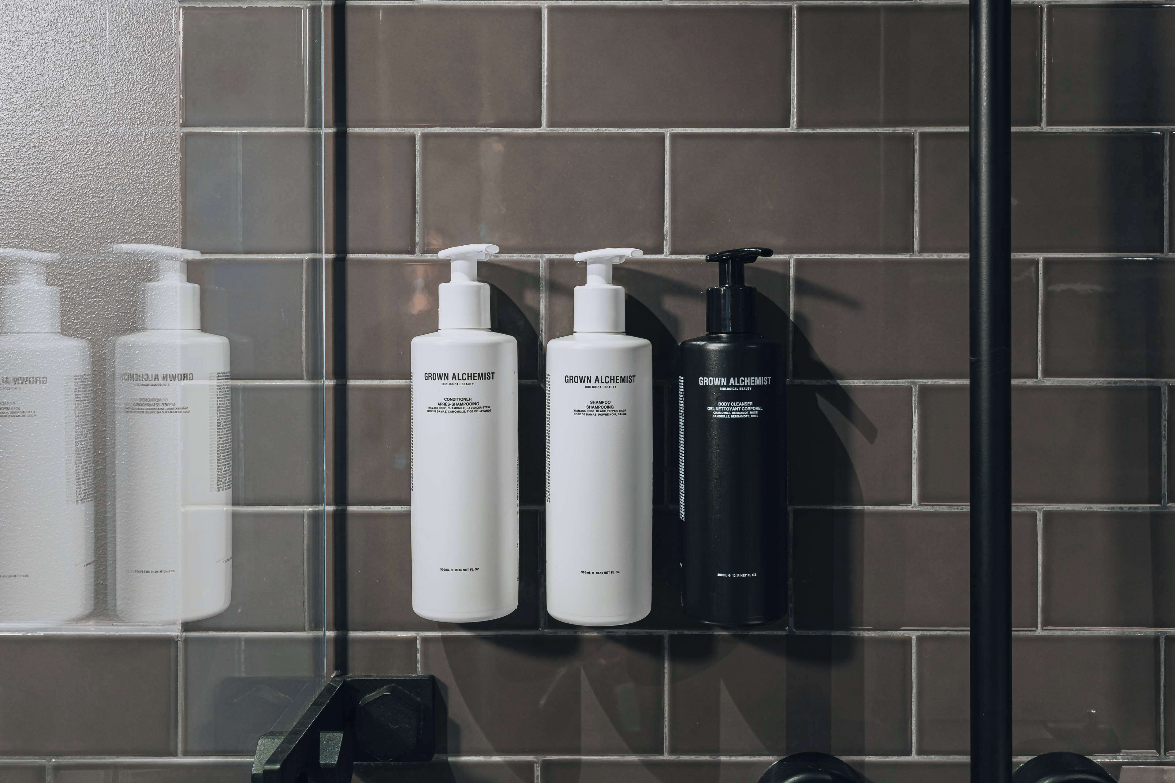 designer toiletries, hair dryer, towels