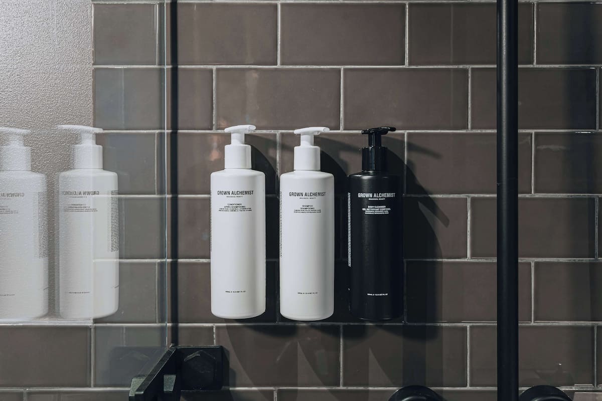 designer toiletries, hair dryer, towels